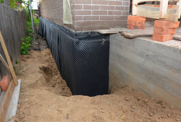 Happy homeowners after waterproofing job in Dameron